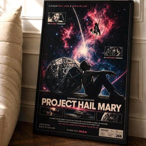 May include: A framed movie poster for "Project Hail Mary" featuring Ryan Gosling. The poster has a space theme with a person sitting, a spaceship, and a geometric shape. Text includes the film title, credits, and "Filmed for IMAX."