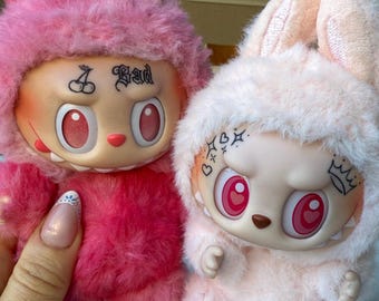 Includes authentic PopMart Labubu plush, customized with real tattoos