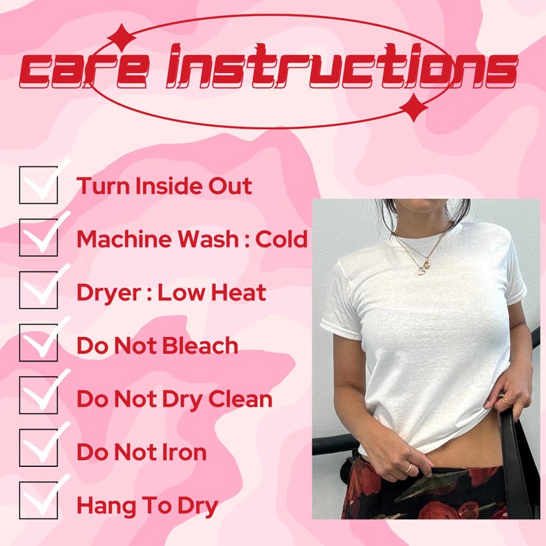 May include: A white crew neck t-shirt with care instructions in a pink and red design. The instructions include turning the shirt inside out, machine washing cold, low heat drying, and avoiding bleach, dry cleaning, and ironing. The shirt is shown being worn.