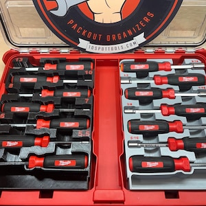 May include: A red toolbox with a clear lid, filled with black and red screwdrivers and nut drivers. The tools are organized in a custom-fit insert. The toolbox has the text "PACKOUT ORGANIZERS" and "10SPOTTOOLS.COM" on the lid.