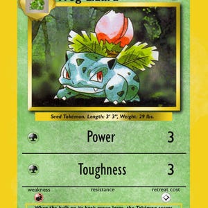 May include: A green and yellow Frog Lizard trading card. The card features a blue and green creature with a bulb on its back. The card text includes "60 HP", "Power 3", and "Toughness 3". The card is 99 cm long and weighs 13 kg.