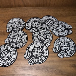 Black embroidered patch with white words for DIY crafts, iron-on, clothing