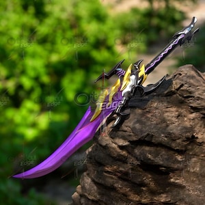 May include: A fantasy sword with a purple blade and black hilt, accented with gold and silver. The sword is displayed on a rock, with a blurred green background. The blade is approximately 60 cm long.