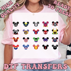 May include: A collection of DTF transfers featuring various superhero-themed Mickey Mouse head designs. The designs include characters like Black Panther, Iron Man, and Captain America. The words "HIGH QUALITY" and "READY TO PRESS" are visible.