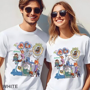 May include: White t-shirts featuring a colorful graphic design with characters from the animated movie "Zootopia". The design includes various animal characters in ornate frames and the word "Zootopia".