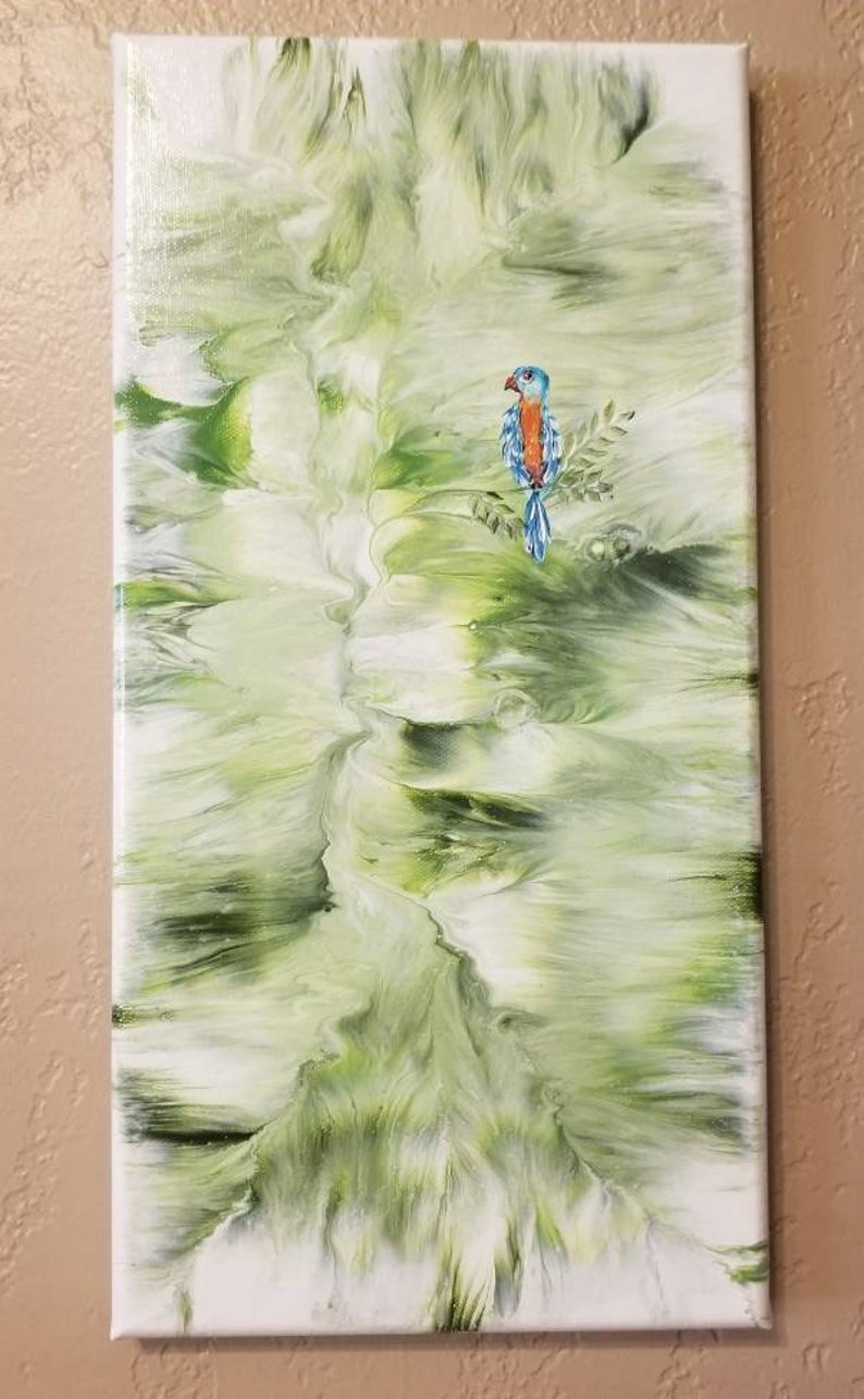 Handpainted 7x14 stretched canvas with parrot embellishment.