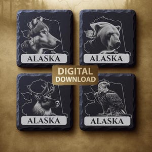 May include: Set of four square slate coasters featuring wildlife illustrations. Each coaster displays a different animal: a wolf, bear, reindeer, and eagle, along with the word "ALASKA". The coasters are dark gray with white outlines and text. A gold sign reads "DIGITAL DOWNLOAD".