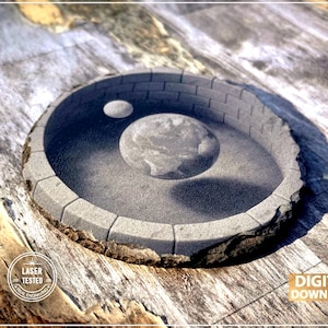 Diseño de posavasos de pizarra con ilusión 3D de la Tierra y la Luna en un pozo: PNG grabado con láser (descarga digital)