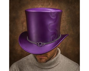 May include: A vibrant purple top hat with a silver chain and ring detail. The hat features decorative stitching and a wide brim. The hat is a bold fashion statement.