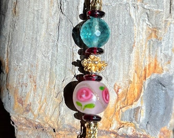 Romance The Rose Bracelet, Murano Rose, Garnets and Faucted Florite combined to create a romantic bracelet.