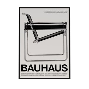 May include: A framed Bauhaus poster featuring a cantilevered chair design. The chair has a black seat and backrest with a chrome frame. The word "BAUHAUS" is prominently displayed in bold, black letters at the bottom of the poster.