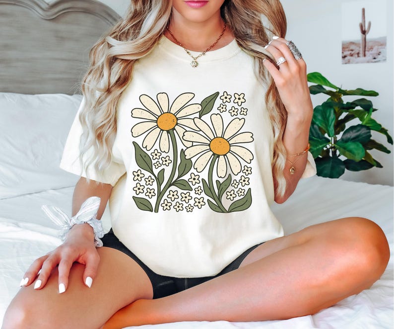 a woman sitting on a bed with her legs crossed
