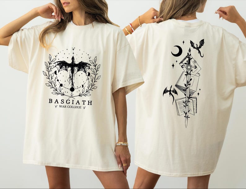 two women wearing white t-shirts with black designs on the back.