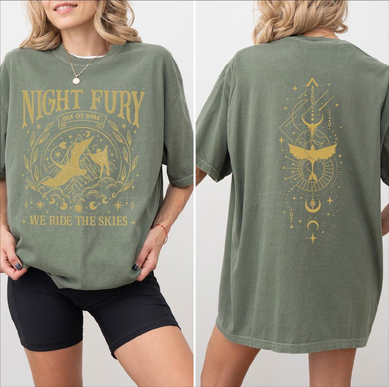 a woman wearing a green t-shirt with a graphic design on the front and back.