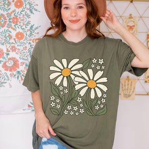 a woman wearing a brown hat and a green shirt