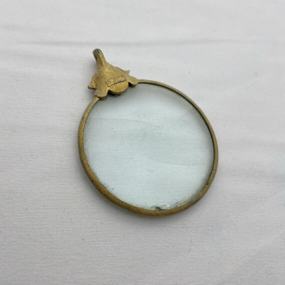 Avon magnifying glass necklace store