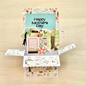3D Box Muttertag Pop Up Karte l Gartenmotiv l Alles Gute zum Muttertag l Stiefel Hut Harke l Rosa Grün Floral l