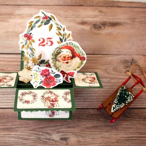Biglietto di Natale pop-up 3D in stile vittoriano con Babbo Natale, rose, ghirlande, stelle e fiocchi di neve, verde oro beige, pieghevole per la spedizione, spedizione gratuita negli Stati Uniti.