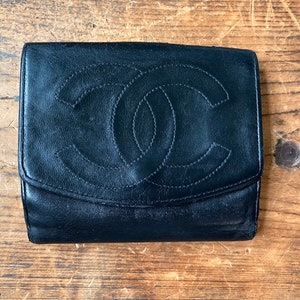 Authentic, Chanel trifold, black soft leather wallet Authenticity card  included