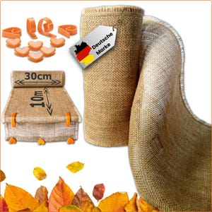 May include: A roll of natural burlap fabric with a tag that reads "Deutsche Marke". The image also shows a section of the burlap unrolled, measuring 30cm wide and 10m long, along with orange clips and heart-shaped accents.
