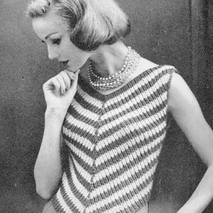 May include: A black and white striped sleeveless top with a V-neckline. The top is knitted and has a loose fit.