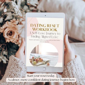May include: A tablet displays the cover of a workbook titled "DATING RESET WORKBOOK: A Self-Love Journey to Finding Aligned Love." The screen shows a book and flowers. The text "Start your reset today. A calmer, more confident dating journey begins here."