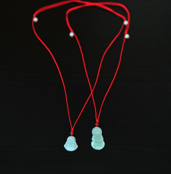 red string necklace buddhist