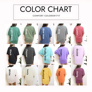 May include: Color chart featuring a variety of Comfort Colors 1717 t-shirts. The shirts are displayed in various colors, including light green, moss, blue jean, gray, cumin, black, pepper, chalky mint, violet, orchid, white, ivory, mustard, yam, and berry.