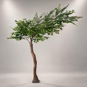 May include: A tall artificial tree with a brown trunk and green leaves. The tree has a slight curve to its trunk and is set on a square base. The leaves are a vibrant green, and the tree appears to be in a studio setting.