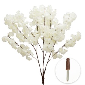 May include: Artificial cherry blossom branch with creamy white flowers and dark brown stems. The branch has a full, lush appearance, perfect for floral arrangements or home decor. The base of the branch is shown in a circular inset.