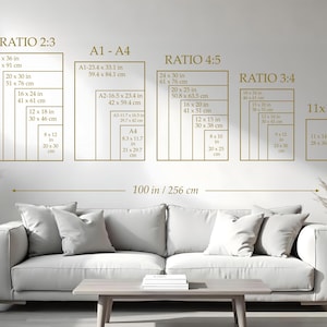 May include: A wall display featuring various rectangular frames with size ratios and dimensions in inches and centimeters. The text includes "RATIO 2:3", "A1-A4", "RATIO 4:5", "RATIO 3:4", and "11x14". A sofa and coffee table are in the foreground.