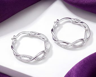 Sterlingzilveren gedraaide oneindigheidsoorbellen, pave Sparkle CZ Stones-ringen, damessieraden