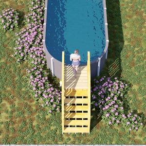 May include: An oval-shaped above-ground swimming pool with blue water, featuring a light-colored wooden staircase leading to the edge. The pool is surrounded by green grass and clusters of pink and purple flowers. Text reads BAMBOO DESIGNS Home Plans & Designs.