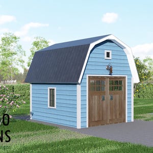 May include: A blue barn-style shed with a dark blue roof and wooden double doors. The shed has white trim and a small window. The image includes the text "BAMBOO DESIGNS Home Plans & Designs". The shed is on a paved driveway.
