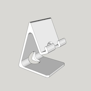 May include: A white, minimalist phone stand with a triangular base and a slanted back. It features a curved support at the bottom and a ledge at the top to hold a phone. The stand is designed to hold a phone upright.