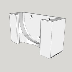 May include: A white, geometric wall-mounted bracket with a curved interior and three circular holes. The bracket has a rectangular shape with two vertical supports and a curved central section.