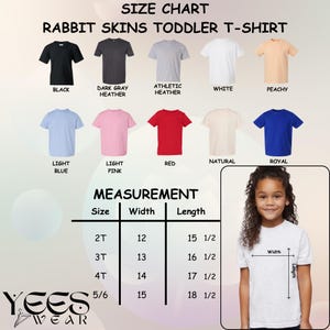 May include: A Rabbit Skins toddler t-shirt size chart displaying ten color options including black, dark gray heather, athletic heather, white, peachy, light blue, light pink, red, natural, and royal, with a measurement table and a visual guide.