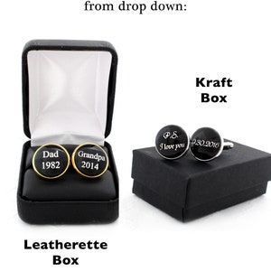 May include: Black and gold cufflinks with personalized text, displayed in a black leatherette box and a black Kraft box. One pair says "Dad 1982" and "Grandpa 2014". The other pair says "P.S. I love you 9.30.2016".