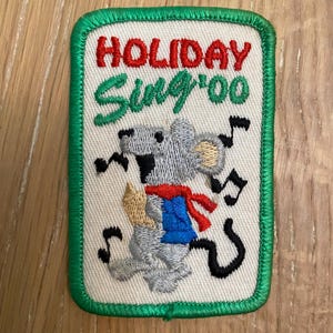 May include: A set of three ceramic mugs with a speckled, matte finish. The mugs are in shades of cream, light gray, and dark gray. Each mug has a simple, minimalist design, perfect for coffee or tea.