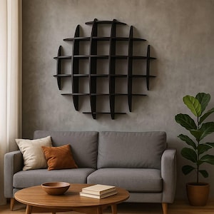 May include: A dark brown, circular wall shelf with multiple shelves, mounted on a gray wall. Below, a gray sofa with throw pillows and a wooden coffee table with books and a bowl. A potted plant is to the right.