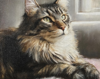 May include: A detailed painting of a Maine Coon cat with brown and tan fur, green eyes, and long whiskers. The cat is lying down on a pink surface, with a window in the background. The artwork is a portrait of a domestic cat.