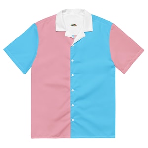 May include: A short-sleeved button-down shirt with a split design. One half is light pink, and the other is light blue. The shirt has a white collar and a small logo on the inside of the collar.