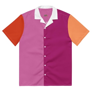 May include: A short-sleeved button-down shirt with a color-block design. The shirt features panels of red-orange, pink, magenta, and orange. It has a white collar and the text "LOVE DIVINE" embroidered near the collar.