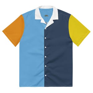 May include: A short-sleeved button-down shirt with a color-block design. The shirt features a white collar and is divided vertically into sections of light blue, navy blue, orange, and yellow. The text "SOUL COLOR" is visible on the collar.