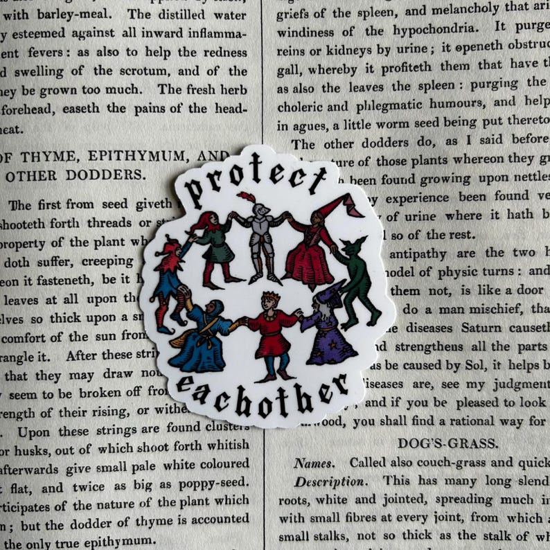 May include: A die-cut sticker featuring a circular illustration of seven diverse medieval-style figures holding hands in a ring. The text "protect eachother" is printed in a black gothic font above and below the figures in a white background.