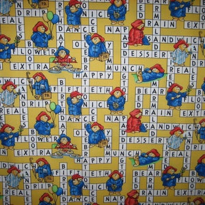 Paddington Bear Yellow crossword puzzle fabric by Quilting Treasures 2008 (18 x 44 inches )