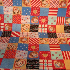 Raggedy Ann and Andy patchwork fabric CP 19719 Simon & Schuster ( 20 x 44 inches )