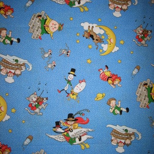 May include: A blue fabric with a repeating pattern of children riding geese, a cat playing a violin, a cow jumping over a crescent moon, and other whimsical characters. The fabric is dotted with small white dots.