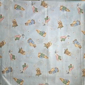 Beatrix Potter fabric characters , on pale blue background, NOJO  ( 27 x 46 inches )  1993