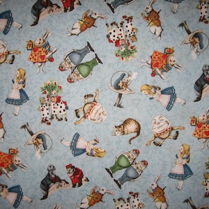 Alice in Wonderland characters, on blue, Windham fabrics by Whistler Studios patt no 30850 ( 17 x 44 inches ) VERY VERY RARE